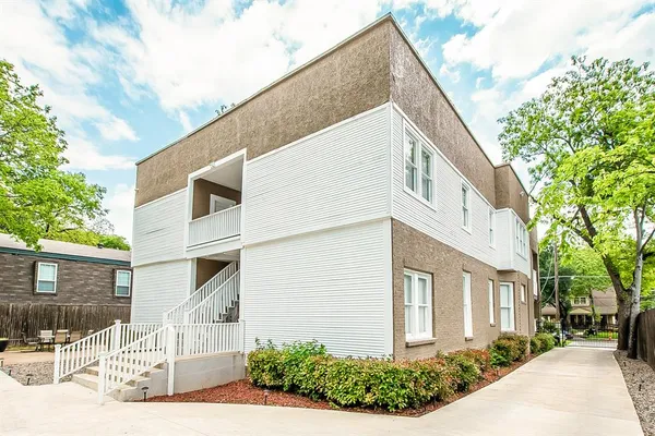 a view of a house with a yard and garage