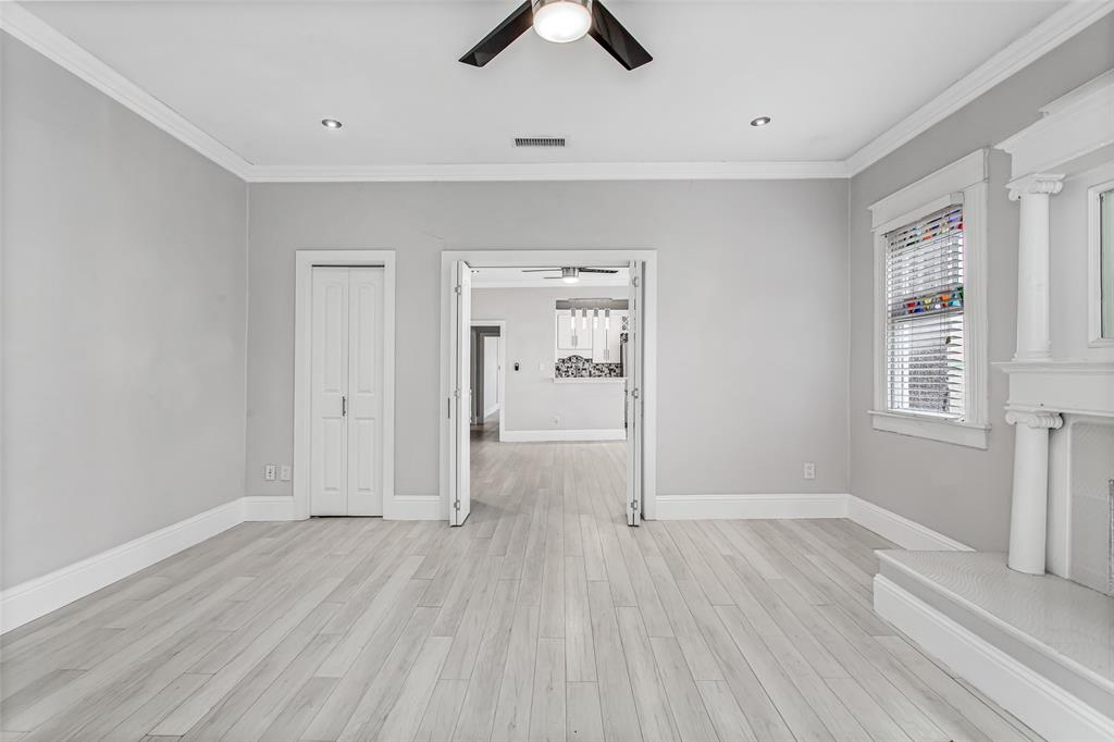 4719 Junius Street, Unit 3 Dallas, TX 75246 - Photo 5 of 38 an empty room with fan and windows