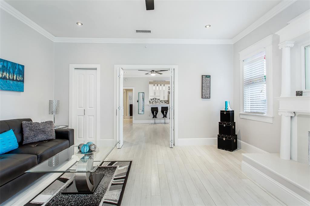 4719 Junius Street, Unit 3 Dallas, TX 75246 - Photo 5 of 36 a living room with furniture and a wooden floor