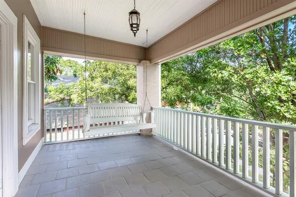 a view of a porch with wooden floor and outdoor space