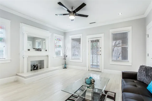 a living room with furniture and a fireplace
