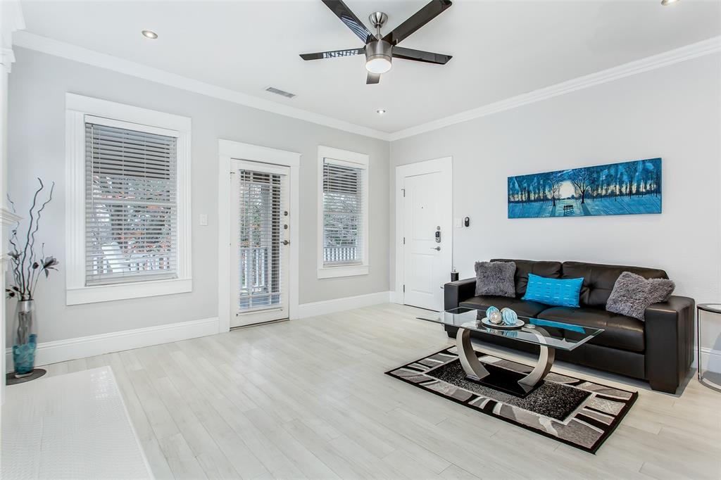 4719 Junius Street, Unit 3 Dallas, TX 75246 - Photo 8 of 36 a living room with furniture and a window