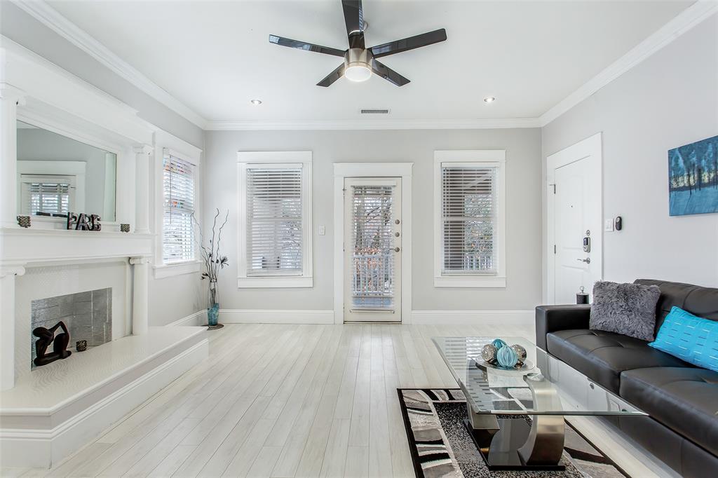 4719 Junius Street, Unit 3 Dallas, TX 75246 - Photo 9 of 36 a living room with furniture and a fireplace
