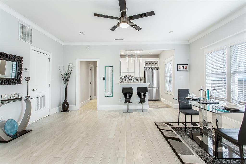 4719 Junius Street, Unit 3 Dallas, TX 75246 - Photo 10 of 36 a view of a livingroom with furniture and a flat screen tv