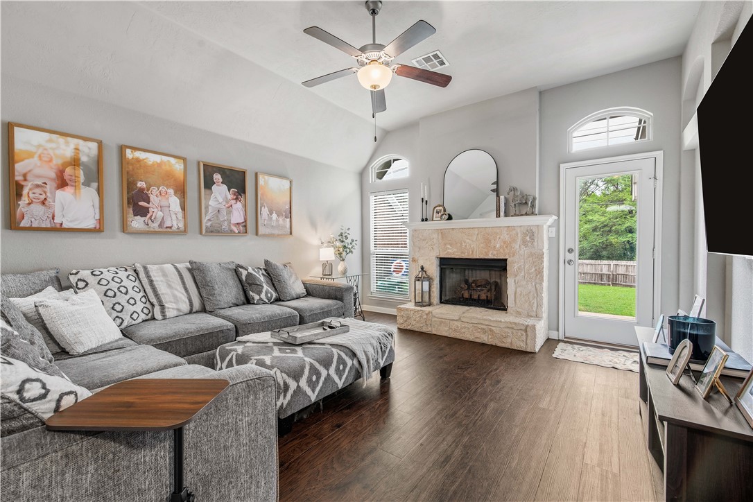 3014 Positano Loop Bryan, TX 77808 - Photo 8 of 23 a living room with furniture fireplace and a large window