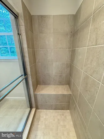 a bathroom with a sink toilet a shower and a mirror