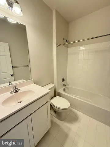 a view of a house with a yard and street view