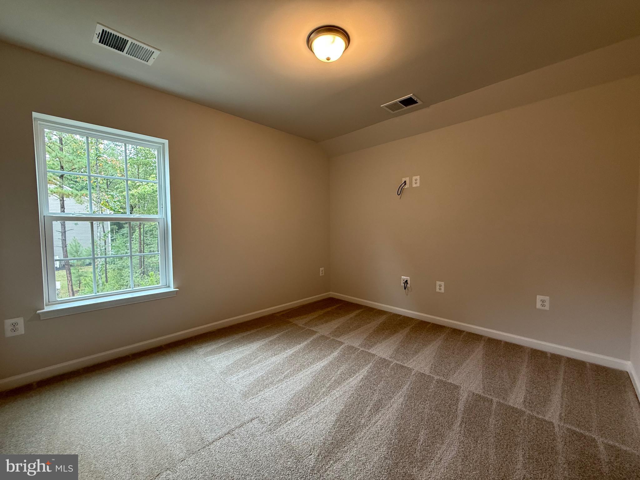 11568 Beacon Hill Court Issue, MD 20645 - Photo 33 of 65 a view of an empty room with a window