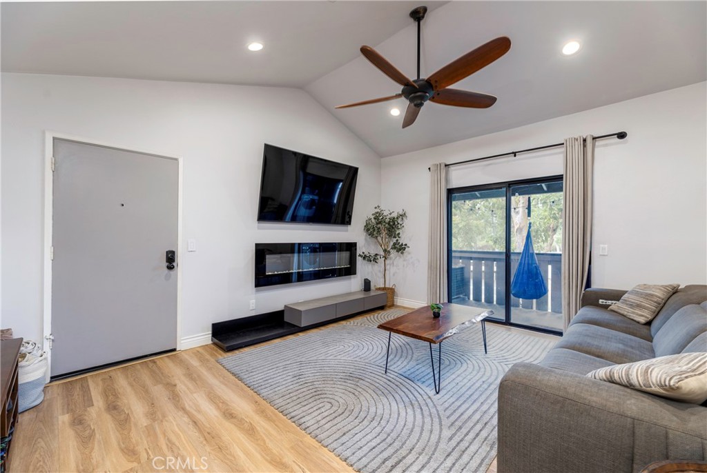 20702 El Toro Road, Unit 178 Lake Forest, CA 92630 - Photo 5 of 30 a living room with furniture a ceiling fan and a flat screen tv