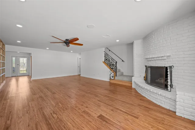 a kitchen with granite countertop white cabinets and stainless steel appliances