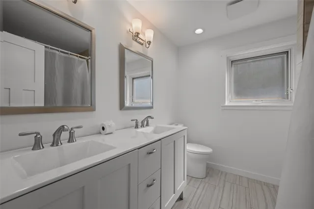 a view of a house with backyard and a tree