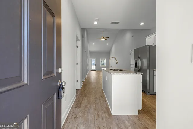 a view of a kitchen from the hallway
