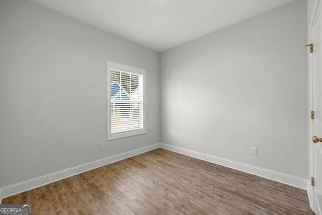 wooden floor and window in an empty room