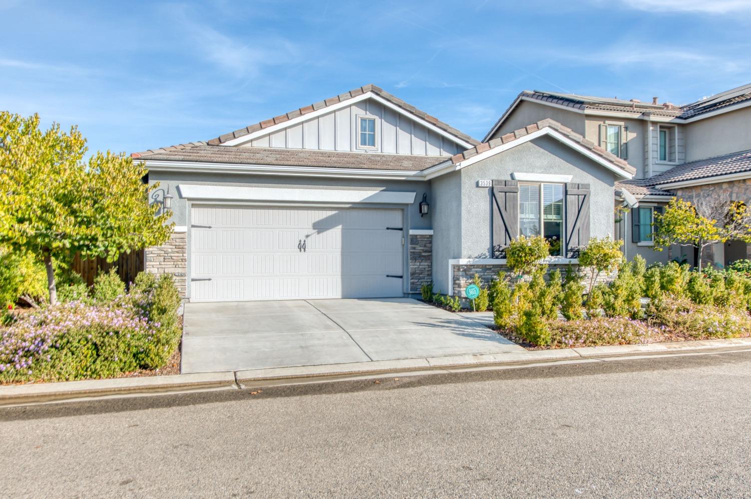 front view of a house with a small yard