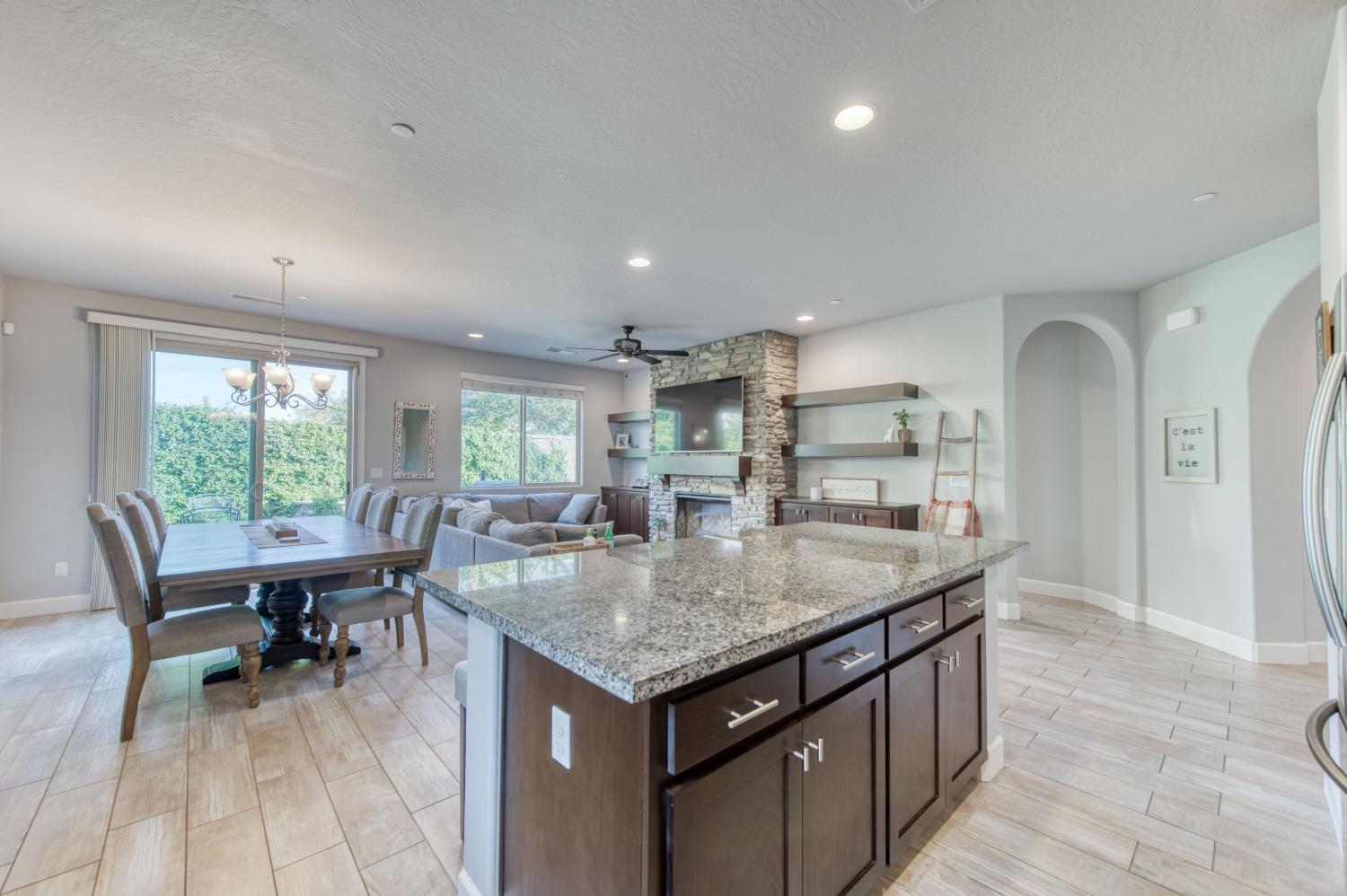 3539 Taylor Lane Clovis, CA 93619 - Photo 11 of 33 an open kitchen with a table and chairs