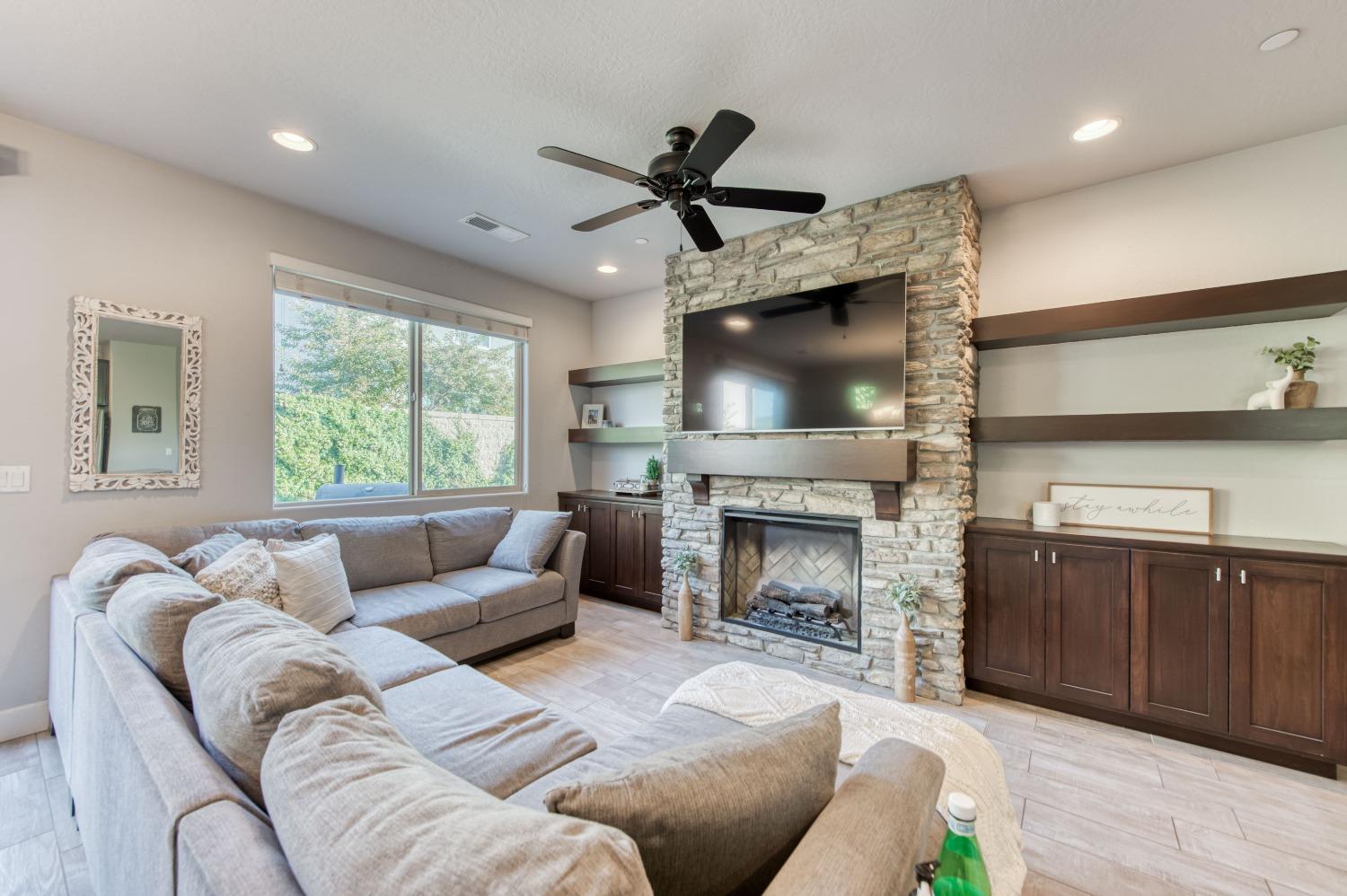 3539 Taylor Lane Clovis, CA 93619 - Photo 14 of 33 a living room with furniture and a fireplace