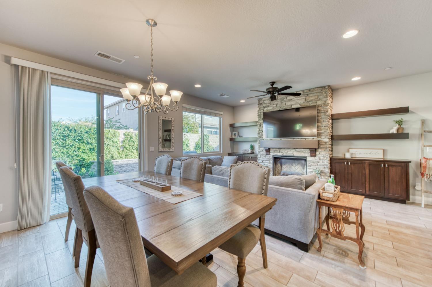 3539 Taylor Lane Clovis, CA 93619 - Photo 17 of 33 a view of a dining room with furniture window and wooden floor