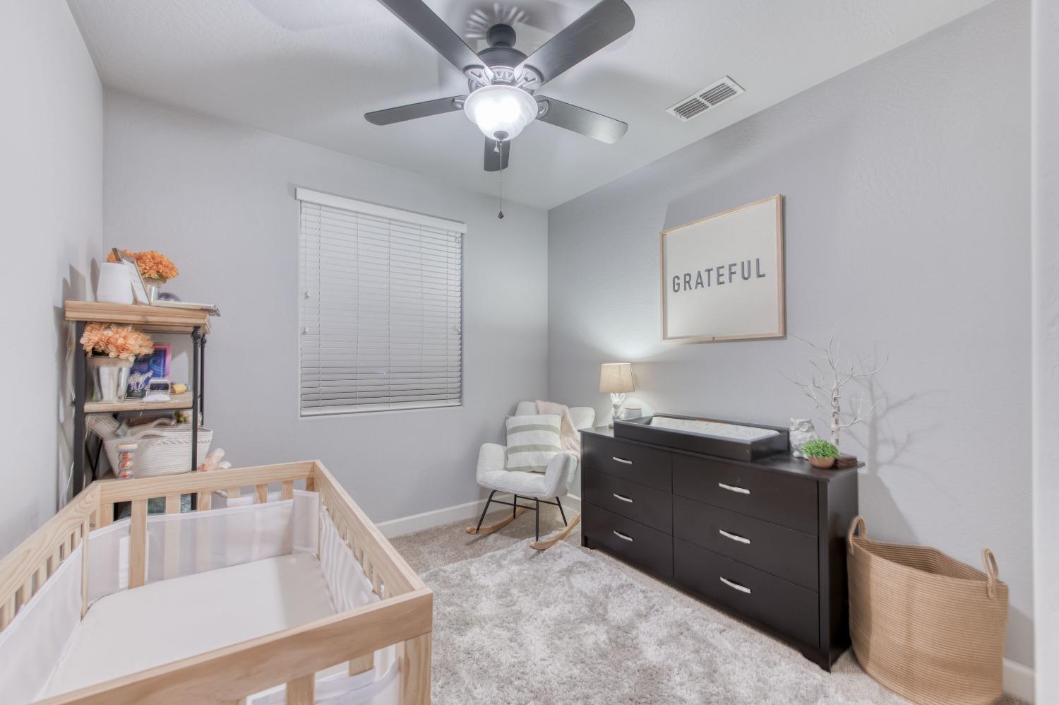 3539 Taylor Lane Clovis, CA 93619 - Photo 18 of 33 a room with a baby bed furniture and a bathtub