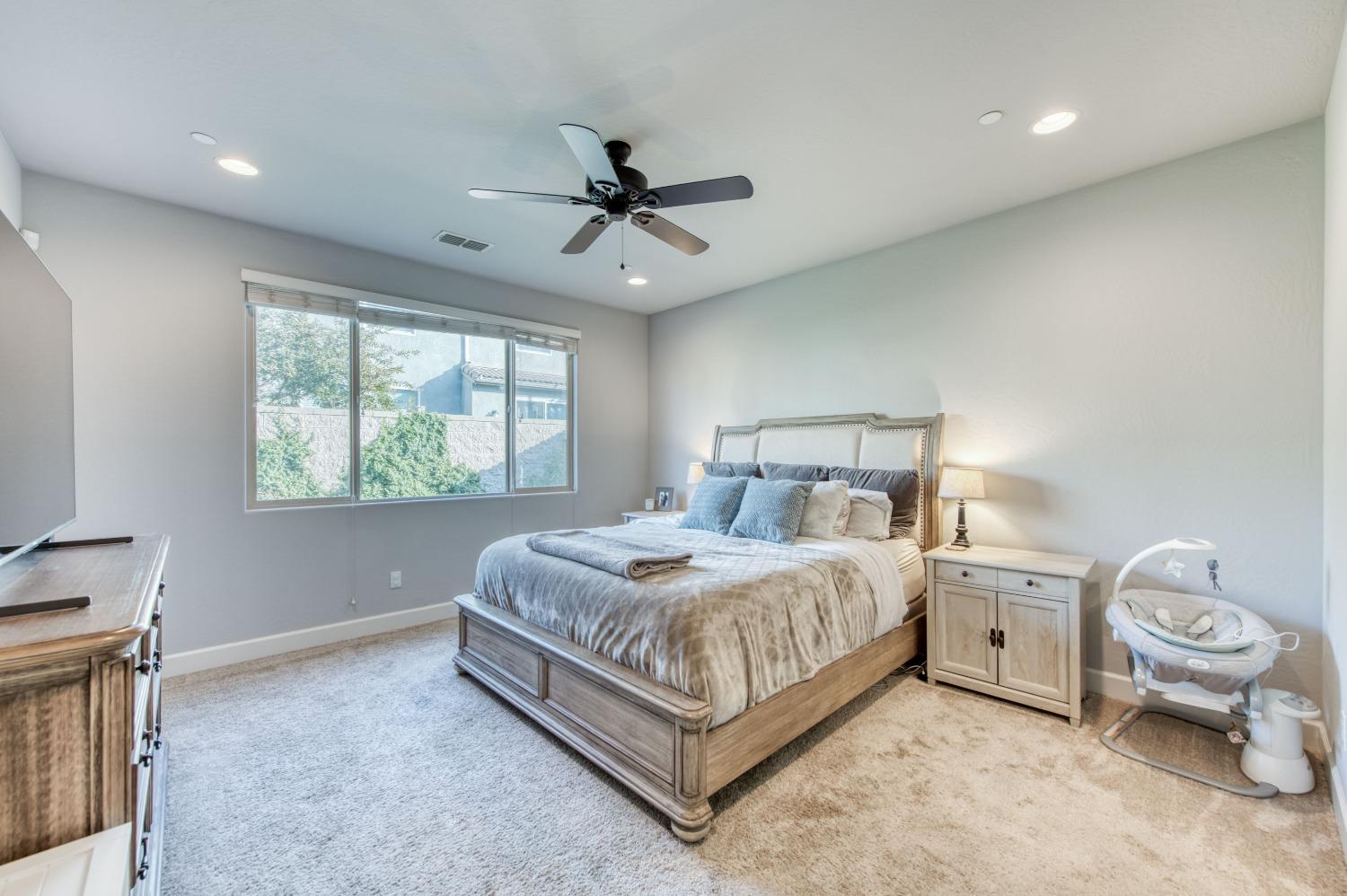 3539 Taylor Lane Clovis, CA 93619 - Photo 28 of 33 a bedroom with a bed and a window