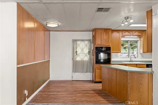 a kitchen with stainless steel appliances a refrigerator and a stove