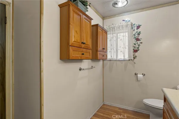 a bathroom with a granite countertop sink mirror vanity and bathtub