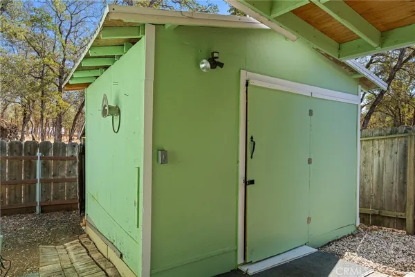 a front view of a house with a garden and sitting area