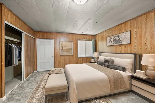 a bedroom with bed and window