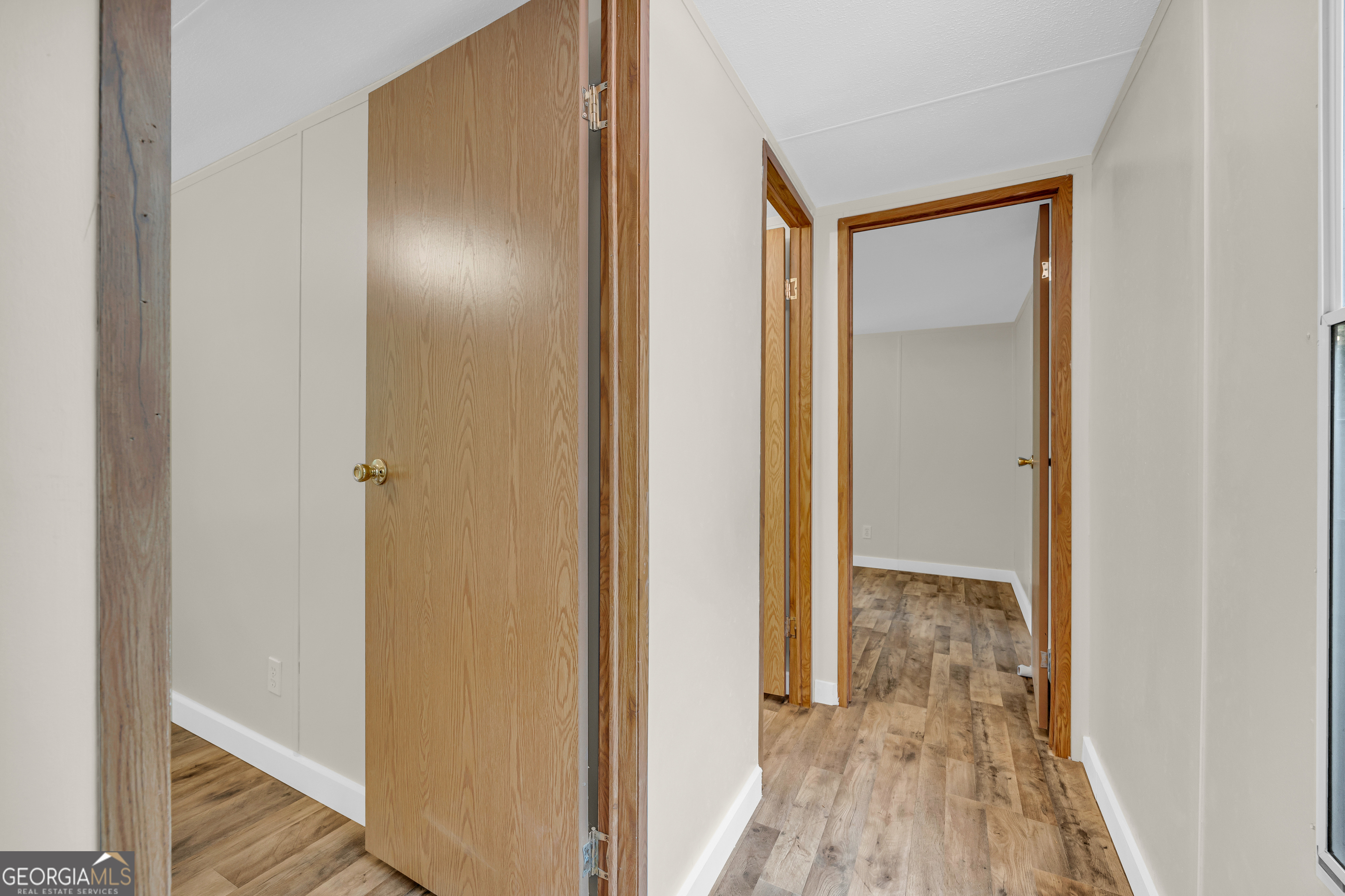 162 Stillwater Road Lavonia, GA 30553 - Photo 12 of 45 a view of a hallway with wooden floor