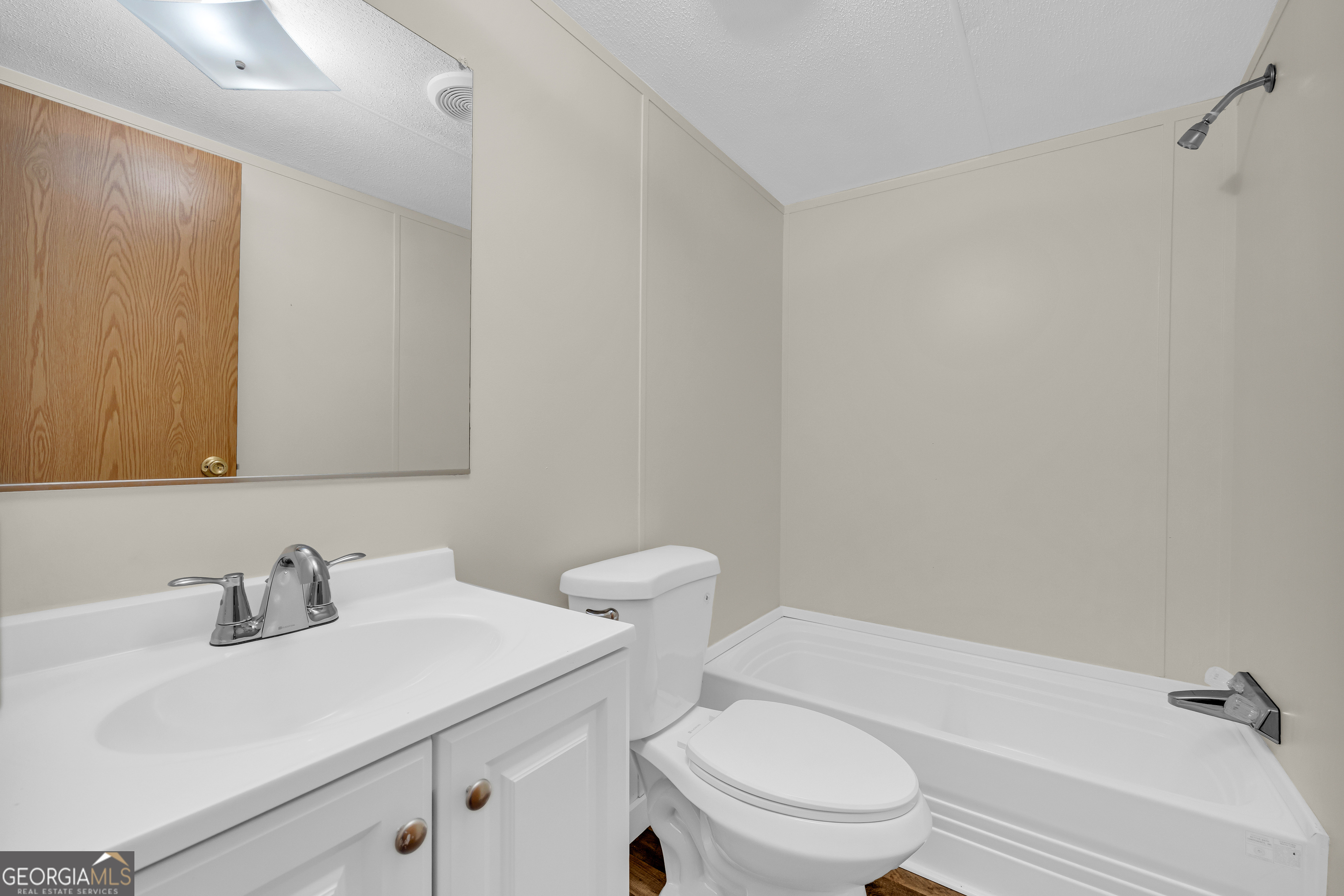 162 Stillwater Road Lavonia, GA 30553 - Photo 15 of 45 a bathroom with a sink toilet vanity and tub