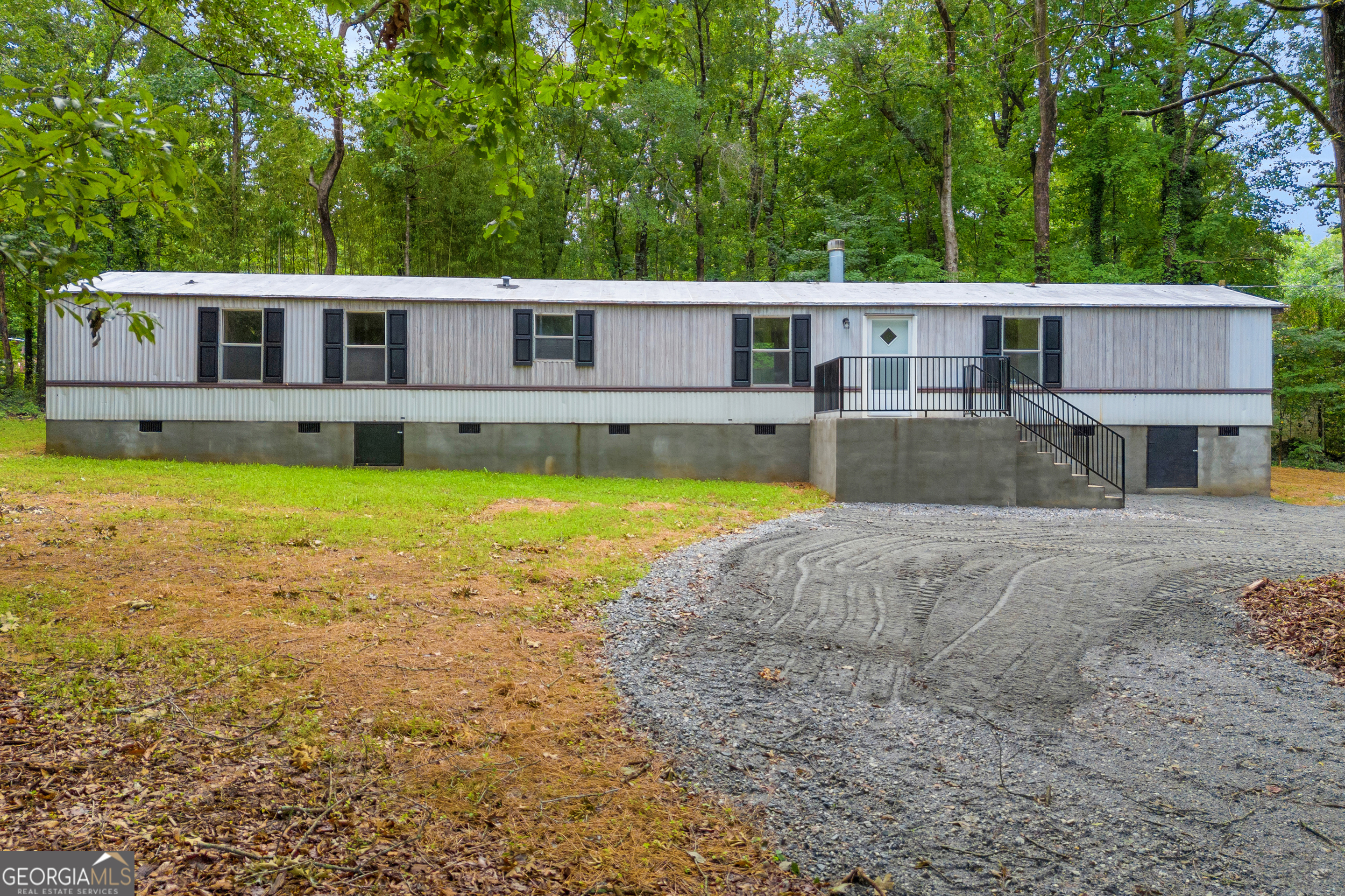 162 Stillwater Road Lavonia, GA 30553 - Photo 2 of 45 a view of a house with swimming pool and a yard