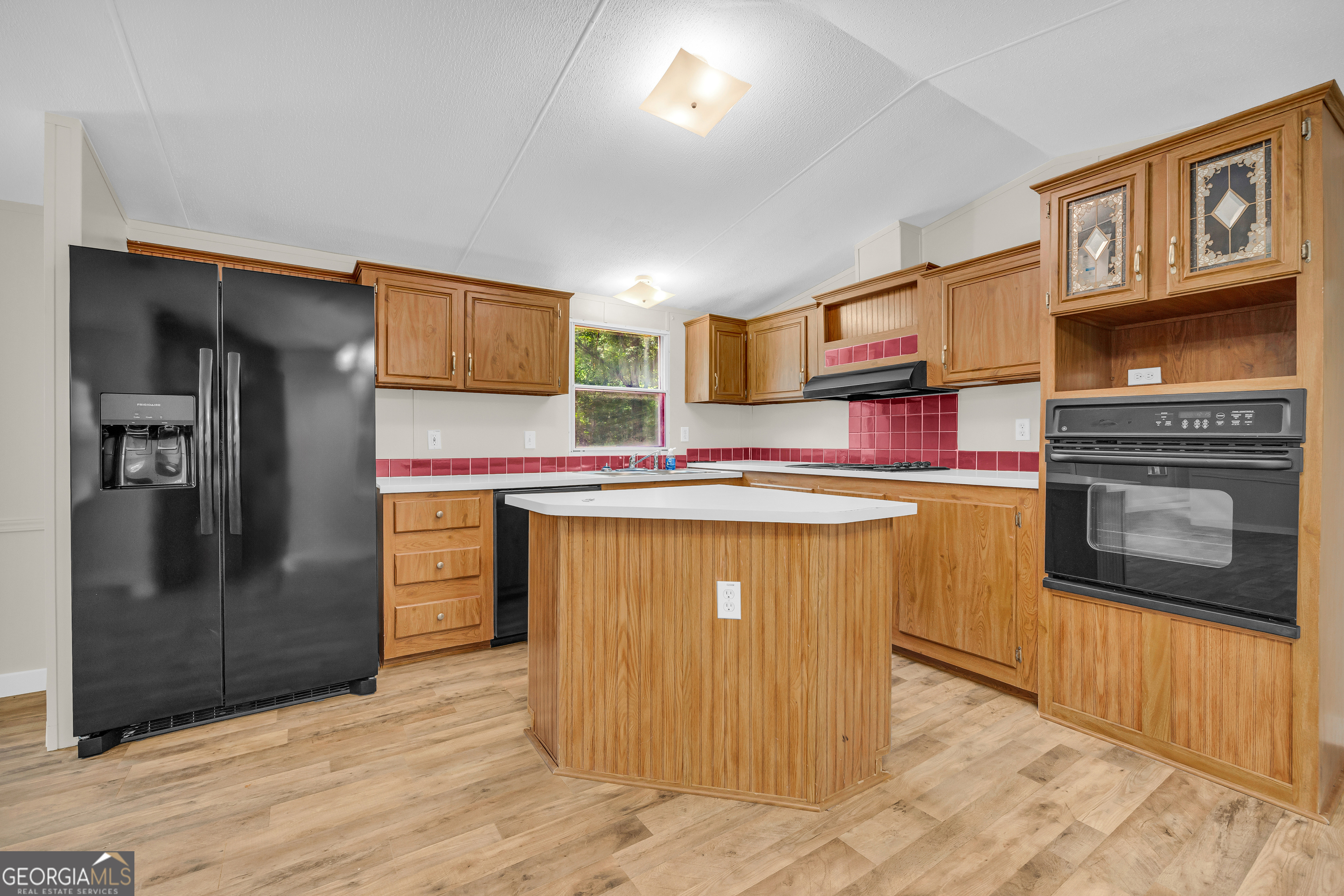 162 Stillwater Road Lavonia, GA 30553 - Photo 21 of 45 a kitchen with stainless steel appliances granite countertop a refrigerator and a stove top oven