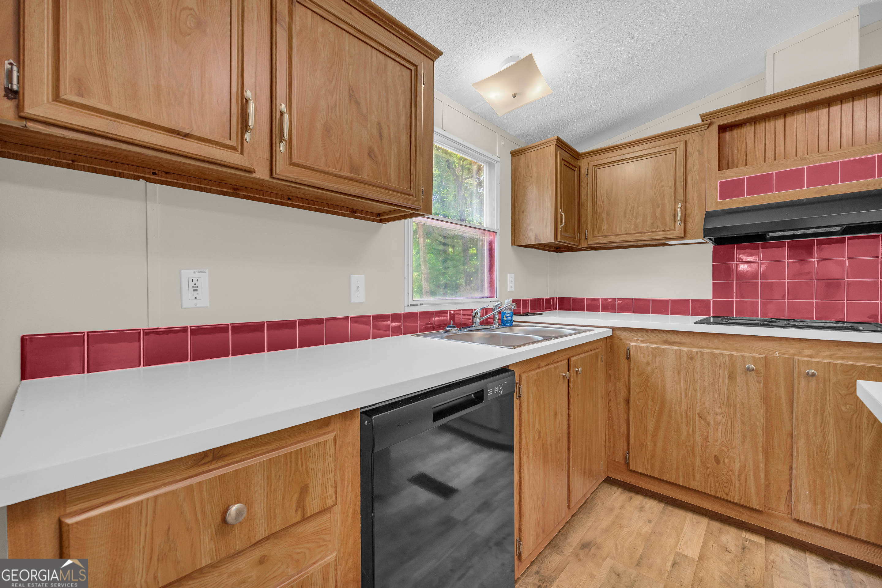 162 Stillwater Road Lavonia, GA 30553 - Photo 22 of 45 a room with washing machine and cabinets