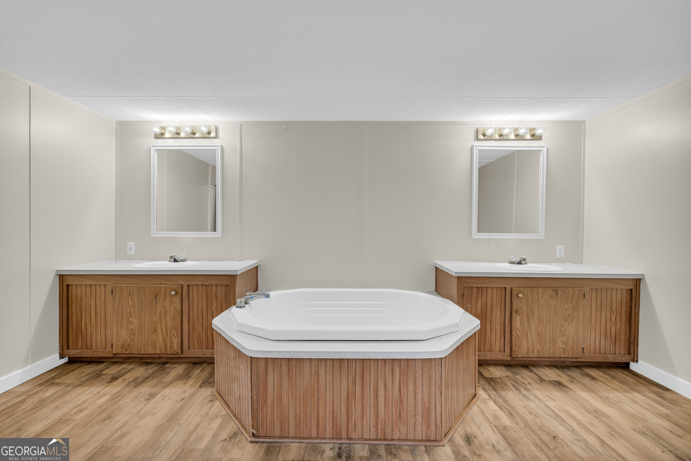 162 Stillwater Road Lavonia, GA 30553 - Photo 30 of 45 a bathroom with a sink a toilet and mirror