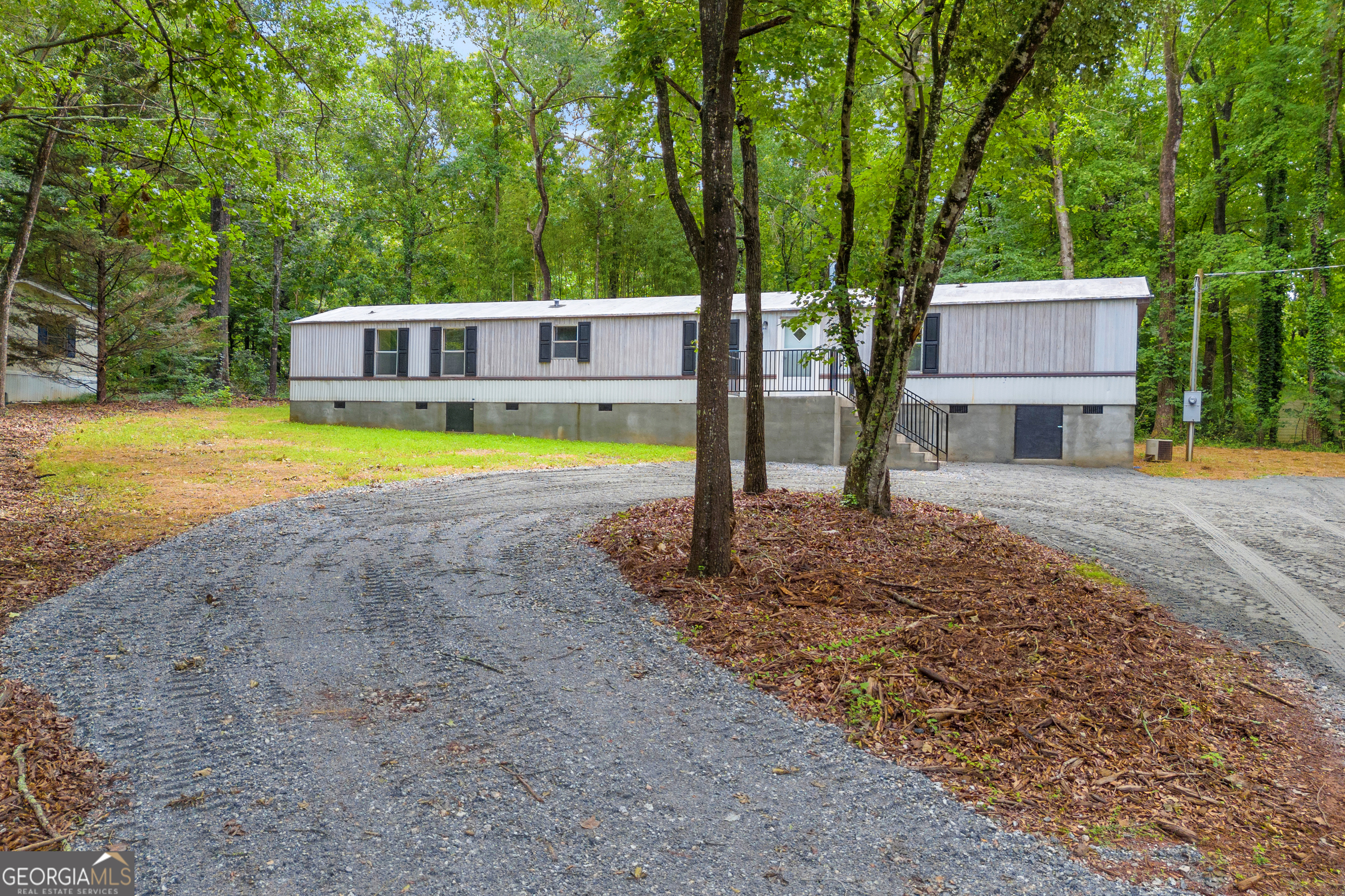 162 Stillwater Road Lavonia, GA 30553 - Photo 3 of 45 a view of a house with swimming pool next to a yard