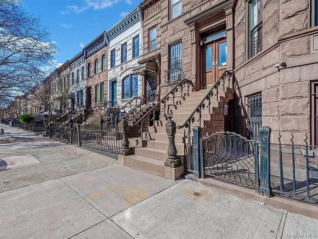 643 Decatur Street, Unit 1 Brooklyn, NY 11233 - Photo 26 of 27 a view of a brick building with many windows
