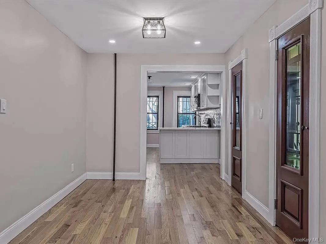 643 Decatur Street, Unit 1 Brooklyn, NY 11233 - Photo 4 of 27 a view of a kitchen cabinets and wooden floor