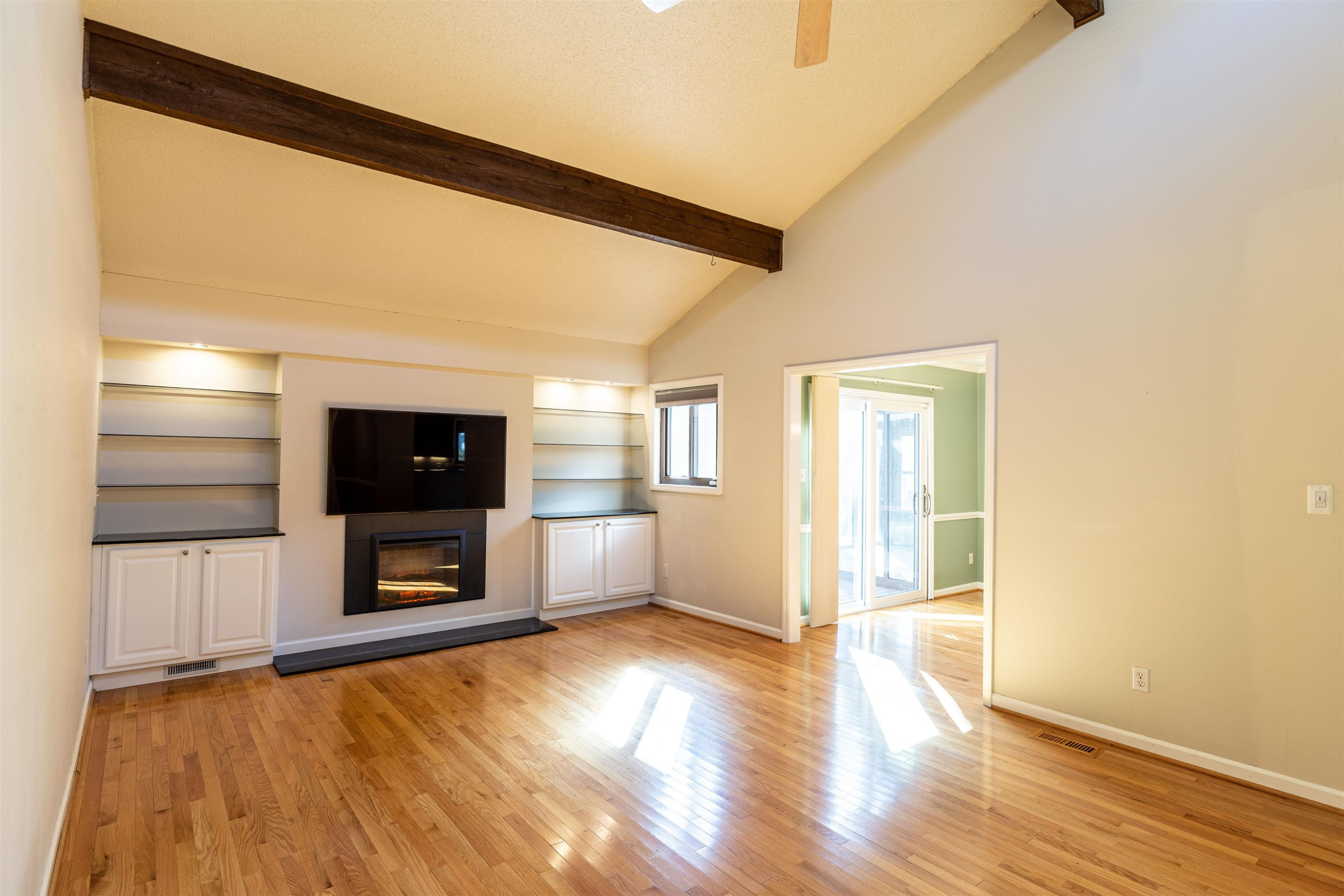505 Ryan Road Cary, NC 27511 - Photo 4 of 30 With vaulted ceiling, exposed wooden beams, 60" flat screen TV Living room