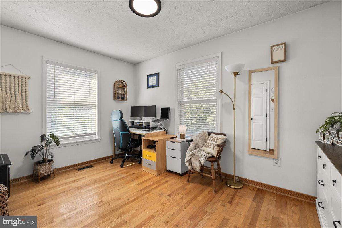 247 Arrowood Road Linden, VA 22642 - Photo 11 of 23 a view of a workspace with furniture and a window
