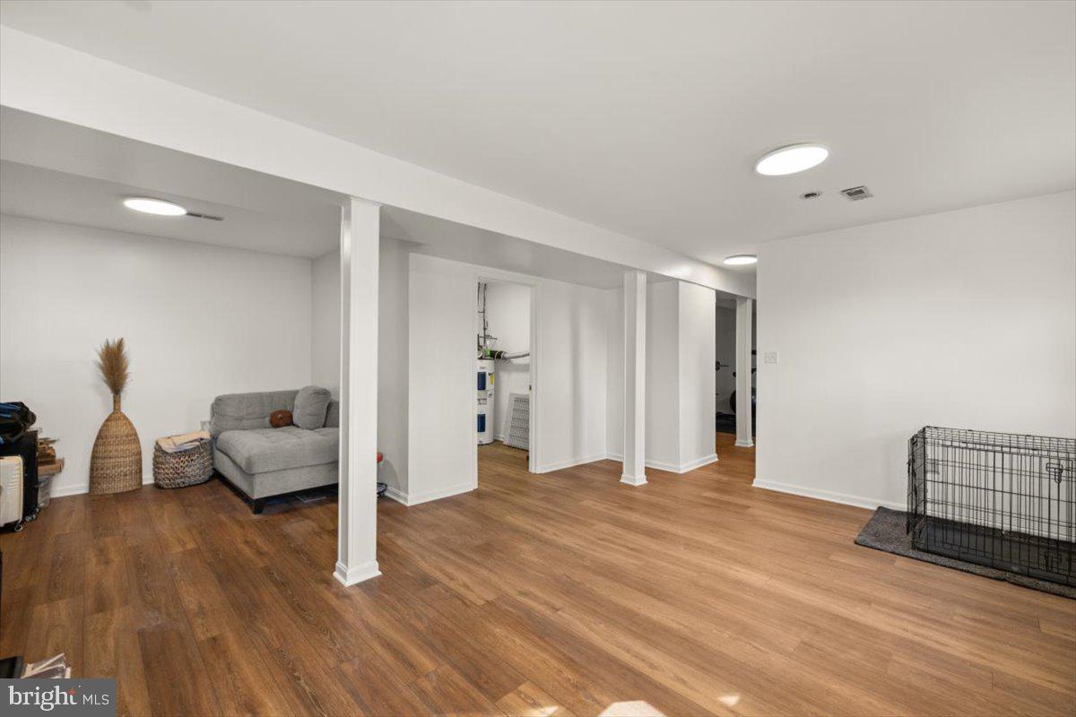 247 Arrowood Road Linden, VA 22642 - Photo 17 of 23 a spacious bedroom with a bed and wooden floor