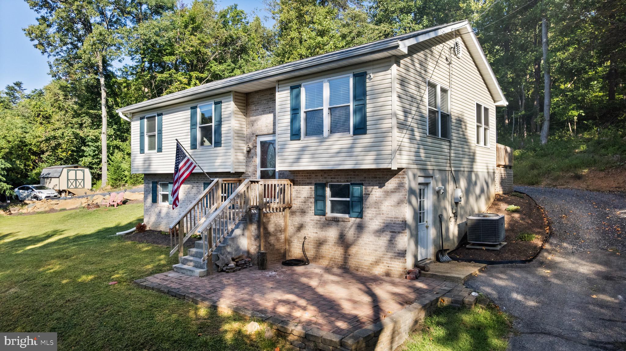 247 Arrowood Road Linden, VA 22642 - Photo 3 of 23 a front view of a house with a yard