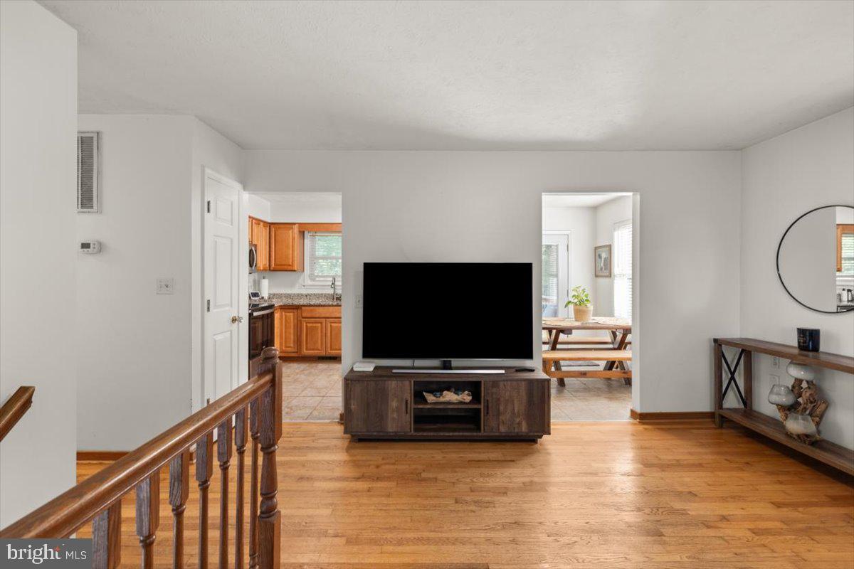 247 Arrowood Road Linden, VA 22642 - Photo 8 of 23 a living room with furniture and a flat screen tv