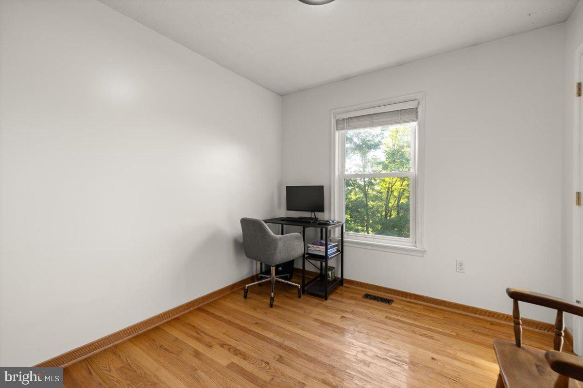 247 Arrowood Road Linden, VA 22642 - Photo 10 of 23 a workspace with wooden floor and a window