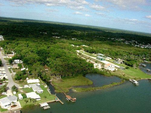 Myrtle Street Edgewater, FL 32141 - Photo 2 of 4 a view of a lake with a yard