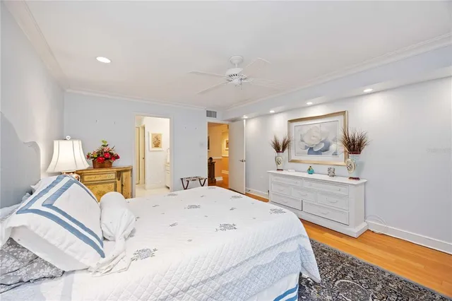 a bedroom with a bed and a dresser in it