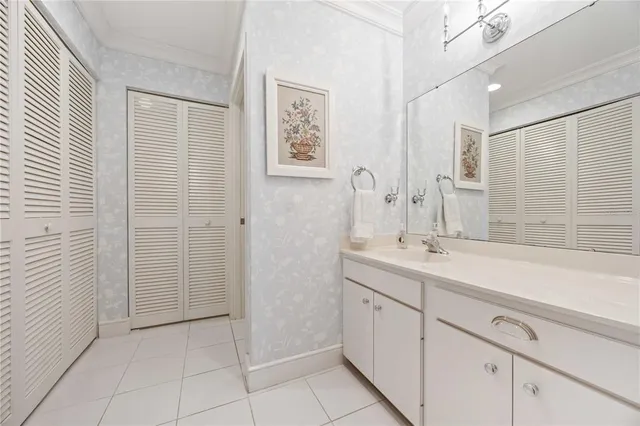 a spacious bathroom with a shower sink and mirror