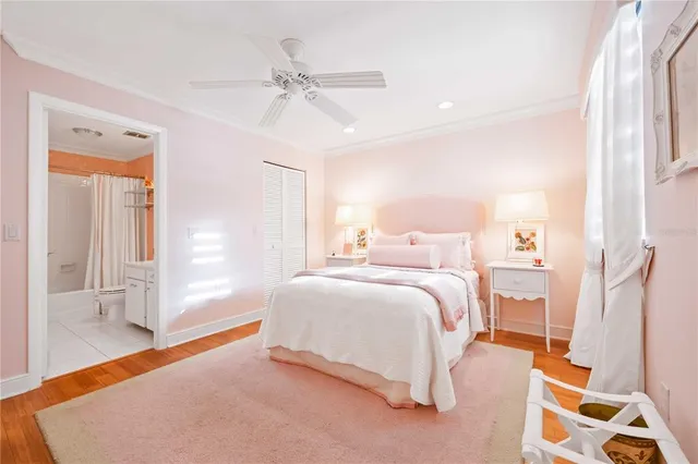 a bedroom with a bed and a mirror