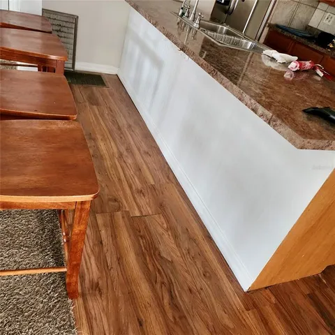 a living room with furniture a ceiling fan and a rug