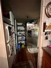 a kitchen with refrigerator and washer