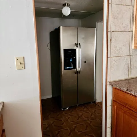 a kitchen with a sink cabinets and appliances