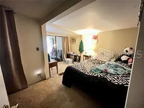 a backyard of a house with a yard and large trees